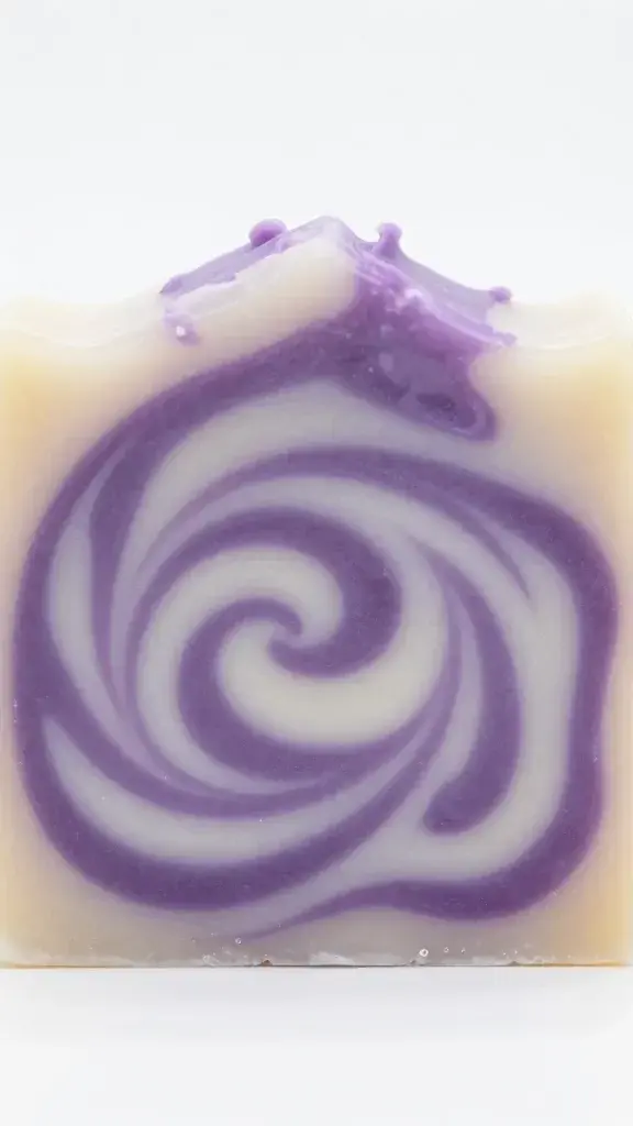 Closeup of handmade soap bar with purple swirl pattern
